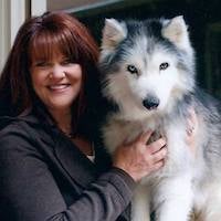 Jackie Roach with a husky dog