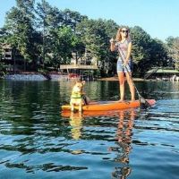 Andie and tan dog on standup paddleboard
