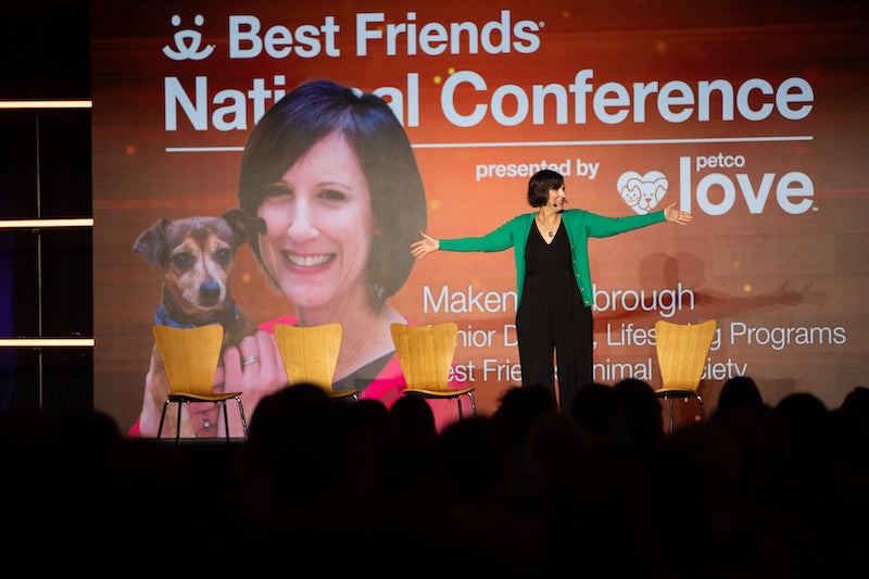 A speaker on stage during the 2023 Best Friends National Conference