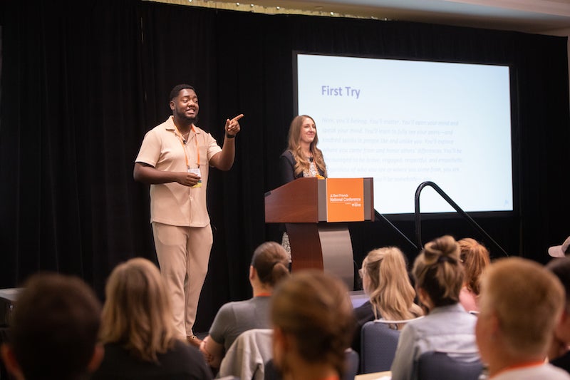 Two speakers on stage during a breakout session at the 2023 Best Friends National Conference