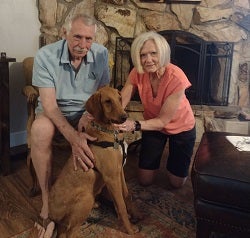 Couple with brown dog