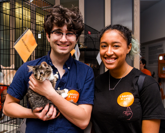 Couple with kitten at adoption event