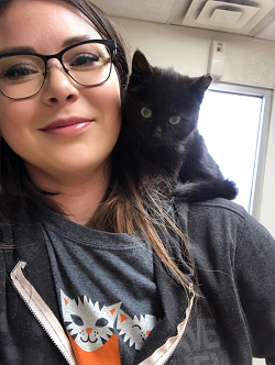 Jessica Gutmann with black kitten on shoulder