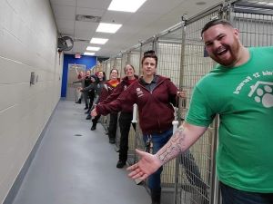 Shelter staff showing empty kennels