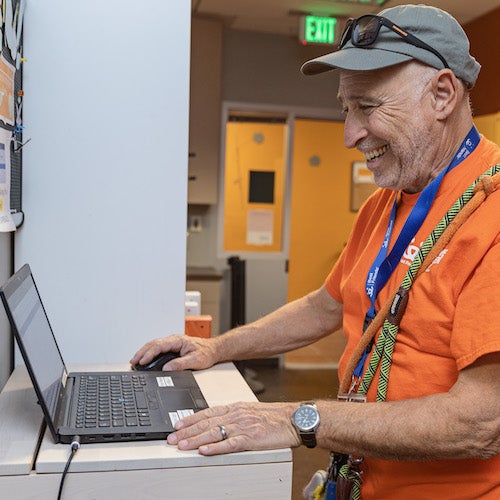 volunteer using a laptop